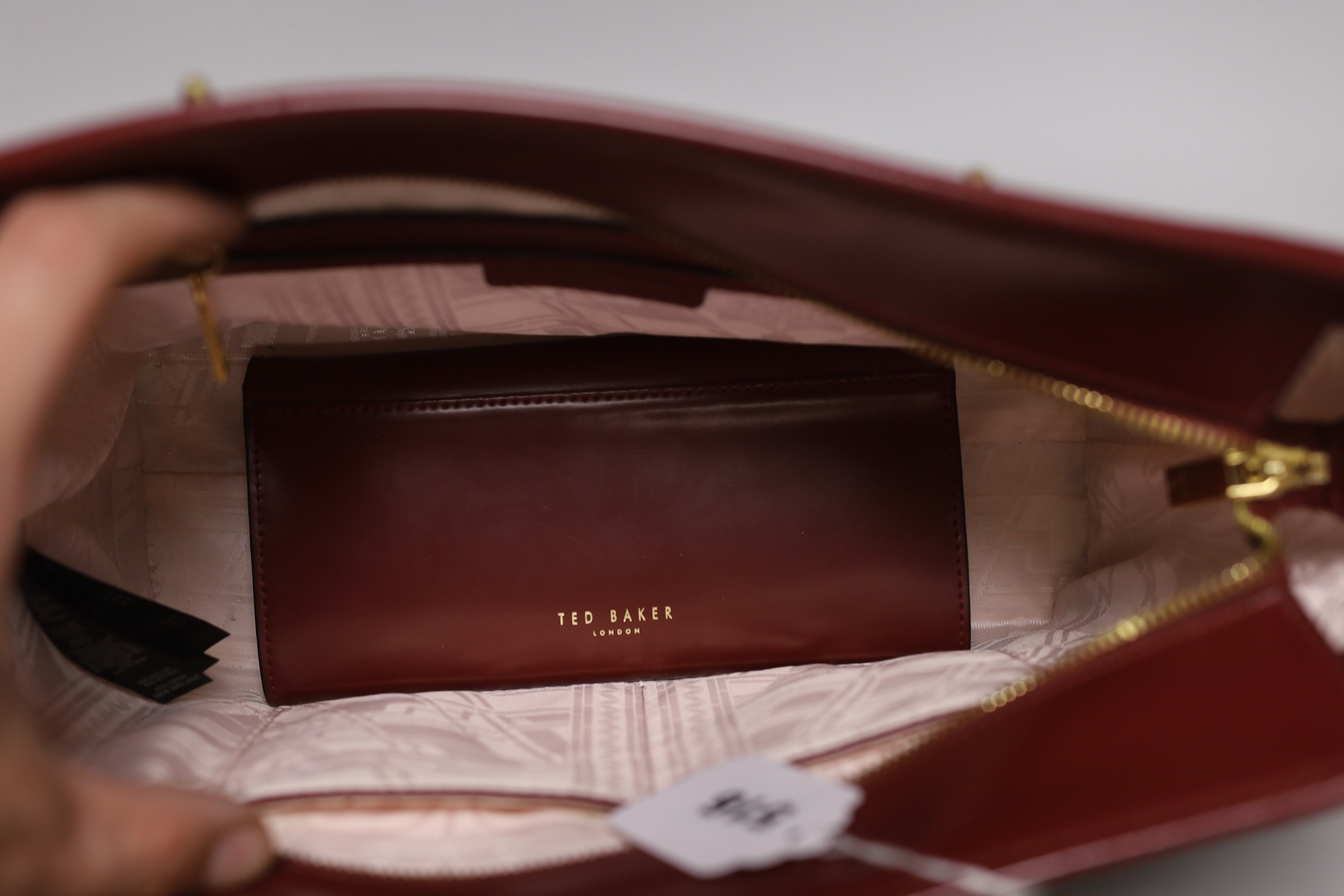 A Ted Baker maroon ladies “shopper” handbag and matching wallet